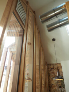 Comme Un Trait architecte d'intérieur LE MANS SARTHE Pays de la Loire Reconstruction d'un espace de fitness. Architecture de réemploi. Atelier. Réactivation. Bois. Nouvel usage. Seconde vie. Réemploi. Reversibilité